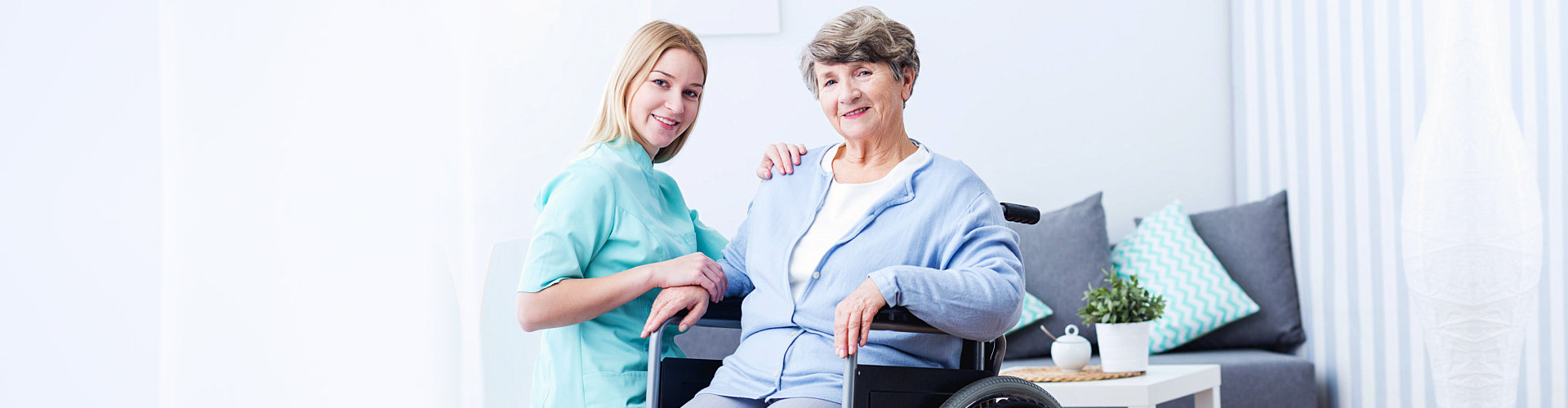 a female nurse with an elderly woman sitting